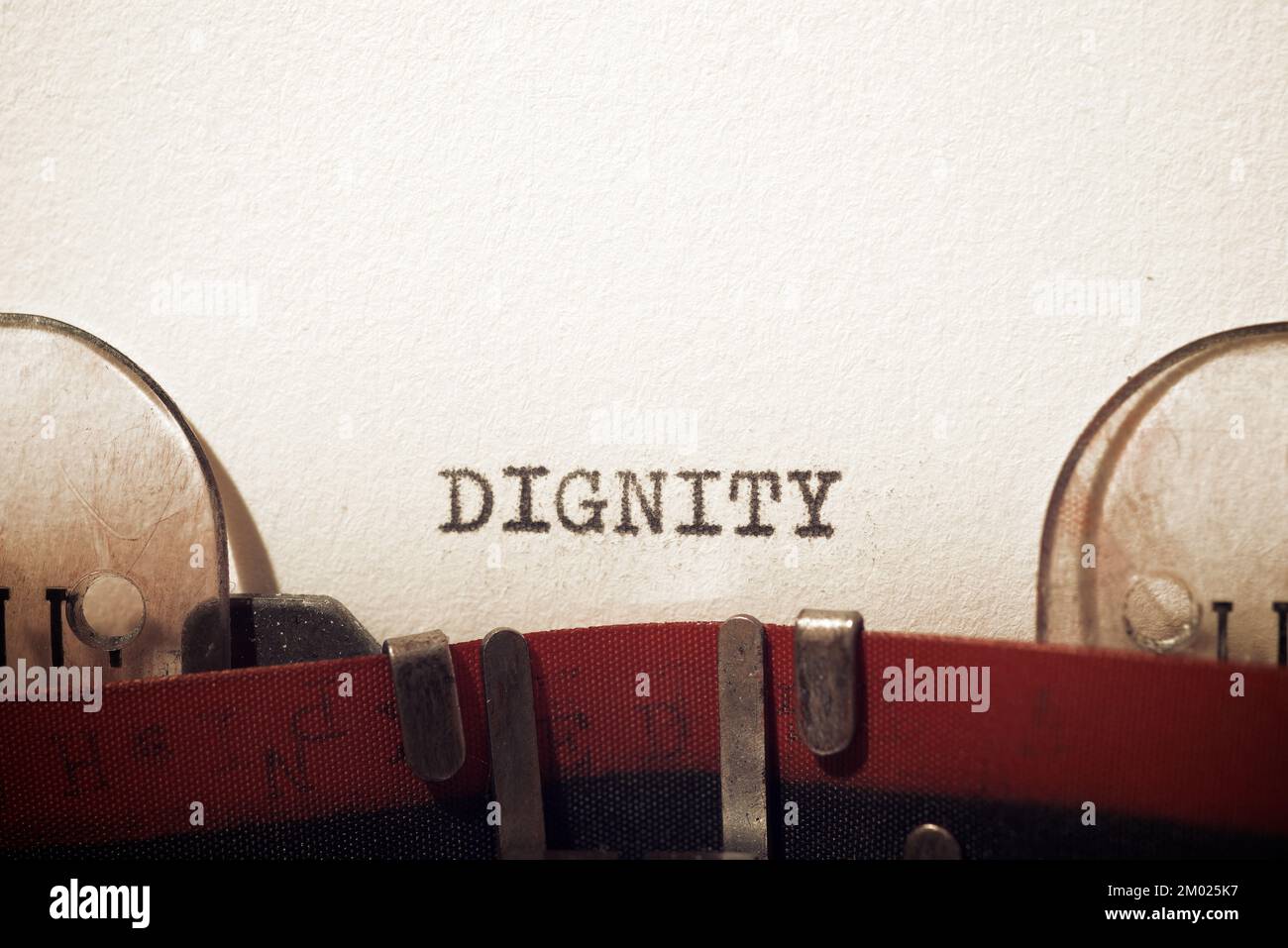 Dignity text written with a typewriter. Stock Photo