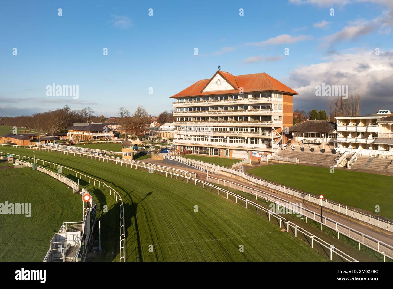 YORK RACECOURSE, UK - DECEMBER 3, 2022.  A landscape view of York Racecourse with Grandstand and paddock at the course winning post or finish line Stock Photo