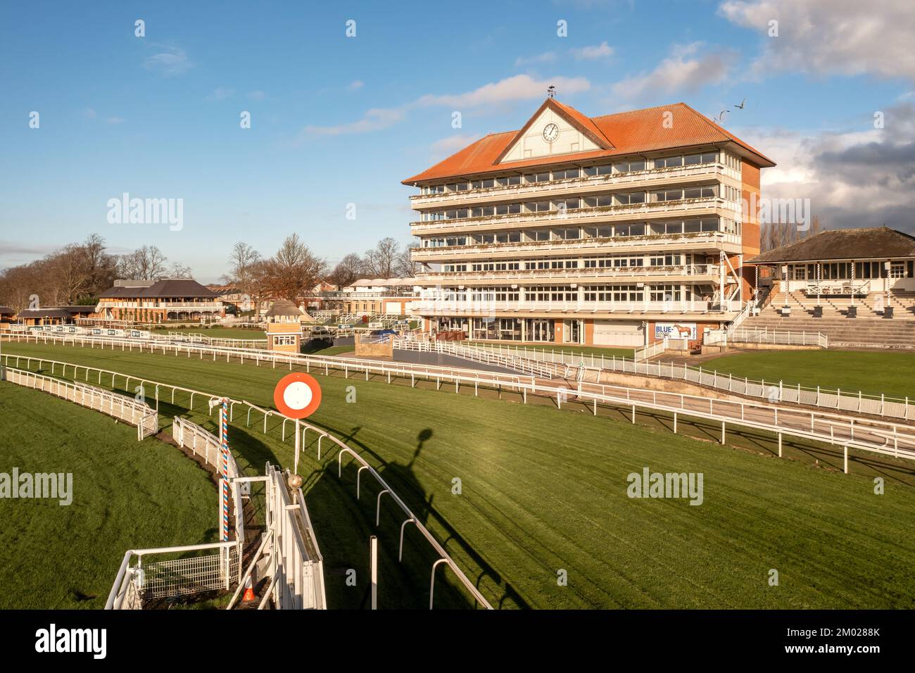 YORK RACECOURSE, UK - DECEMBER 3, 2022.  A landscape view of York Racecourse with Grandstand and paddock at the course winning post or finish line Stock Photo