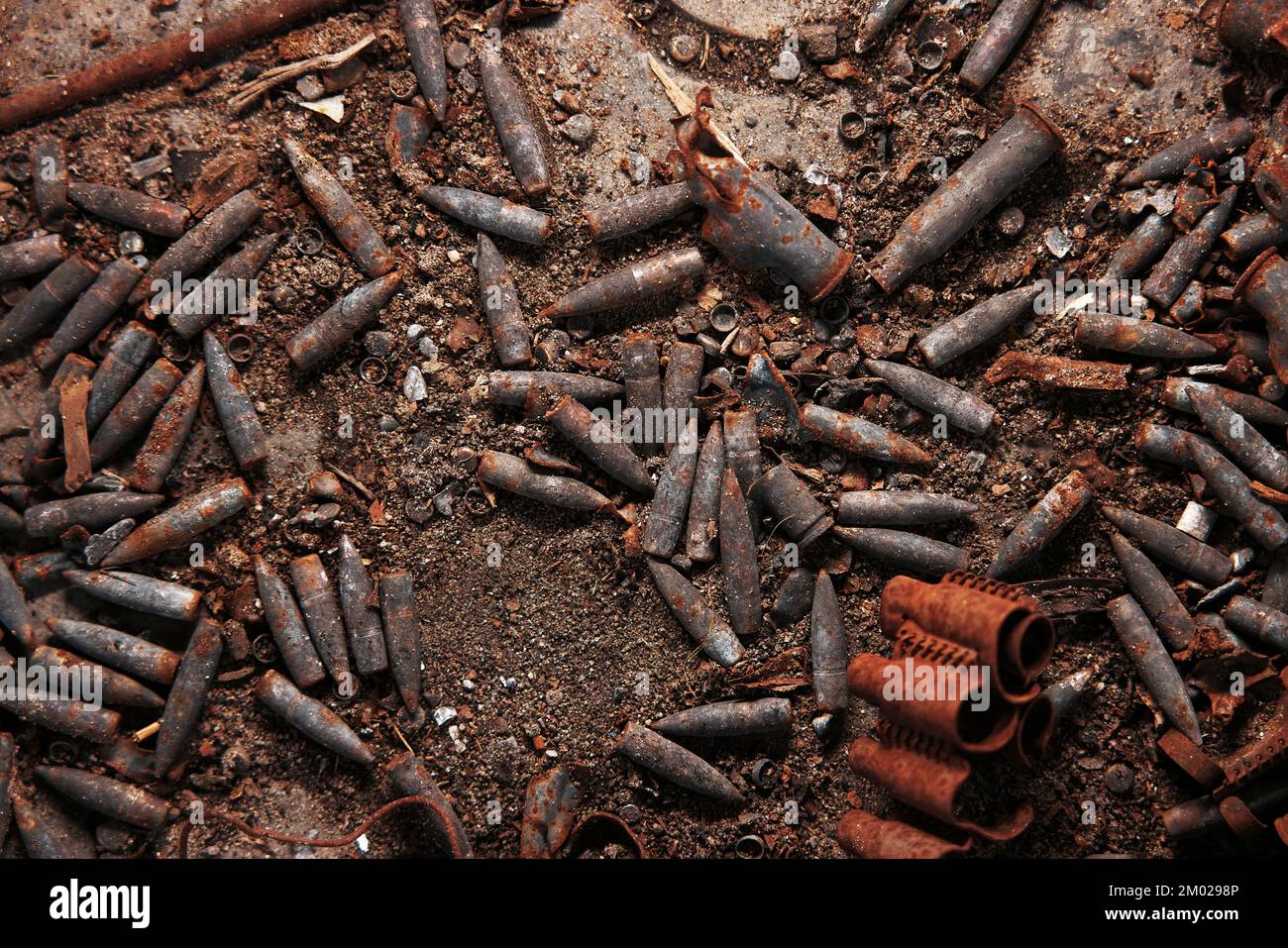 Burnt ammunition, bullets and casings after the fire. Burned arsenal of weapons, fire in the