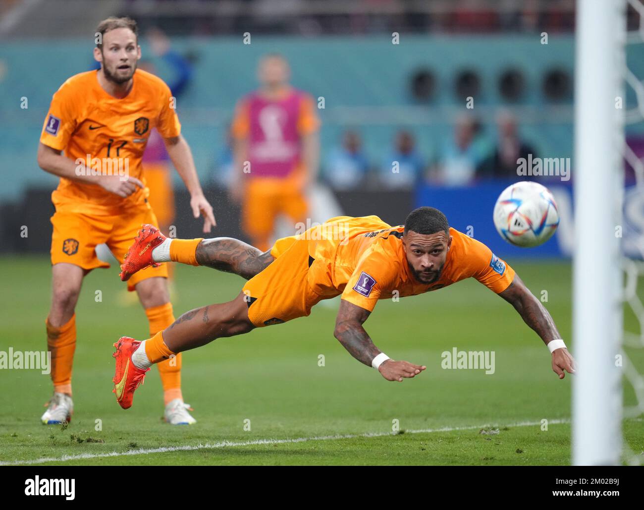Netherlands' Memphis Depay with a diving header towards goal that is saved during the FIFA World Cup round of 16 match at the Khalifa International Stadium in Al Rayyan, Qatar. Picture date: Saturday December 3, 2022. Stock Photo