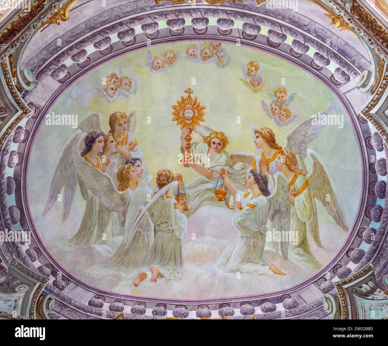 MORGEX, ITALY - JULY 14, 2018: The ceiling fresco of Eucharistic adoration of angels in church Chiesa di Santa Maria Assunta E. Lancia (1932). Stock Photo