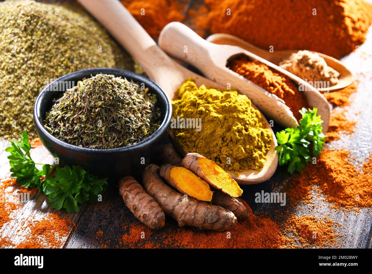 Composition with spices on wooden kitchen table. Stock Photo