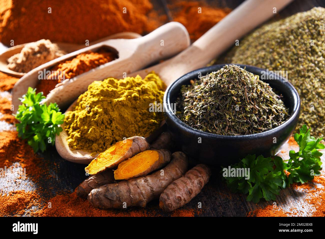 Composition with spices on wooden kitchen table. Stock Photo