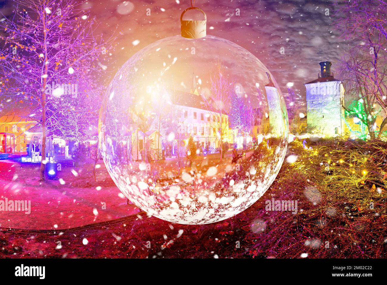 Zagreb historic upper town advent evening snow view through glass christmas ball light view, xmas time in capital of Croatia Stock Photo
