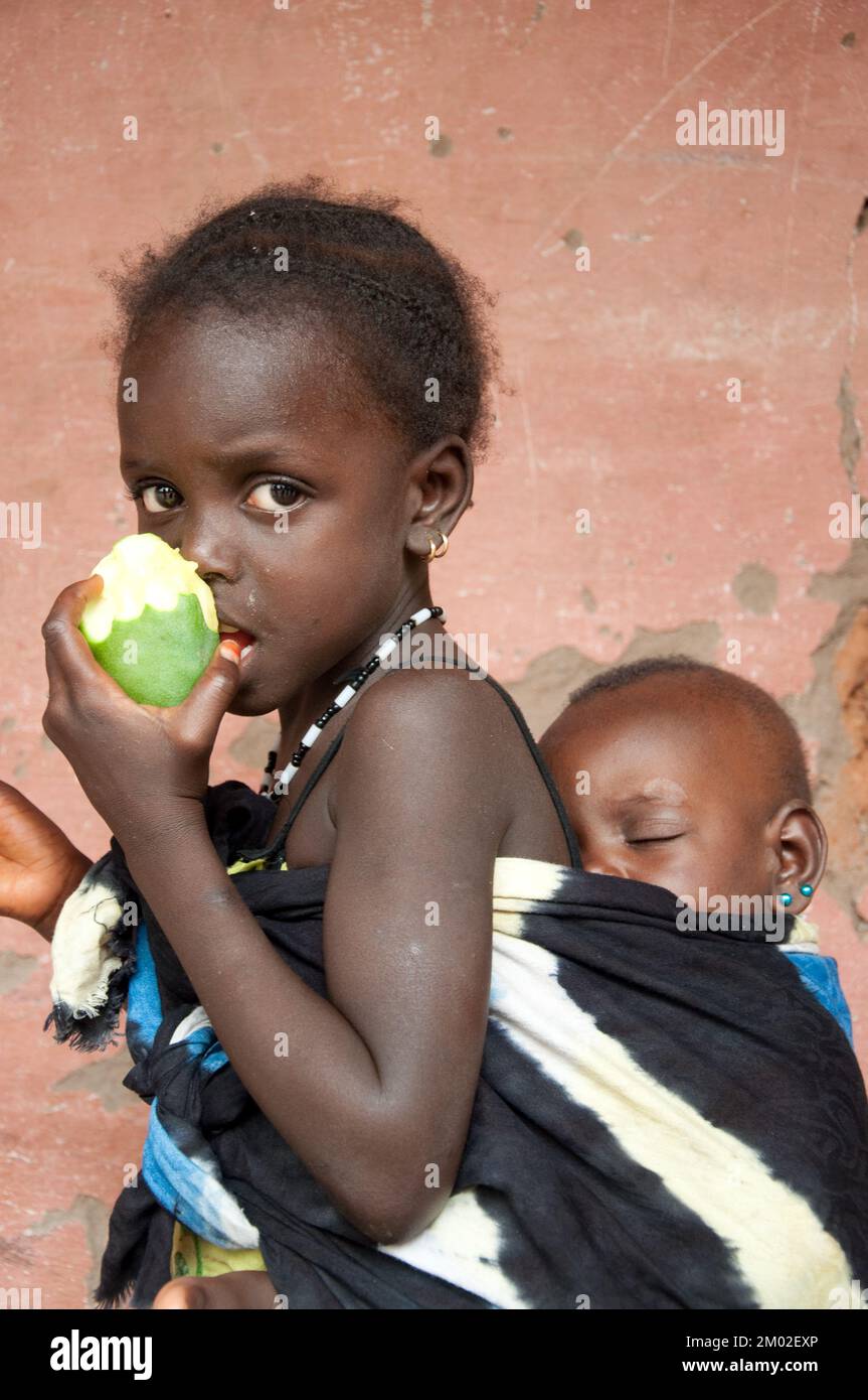 Baby eating mango hi-res stock photography and images - Alamy