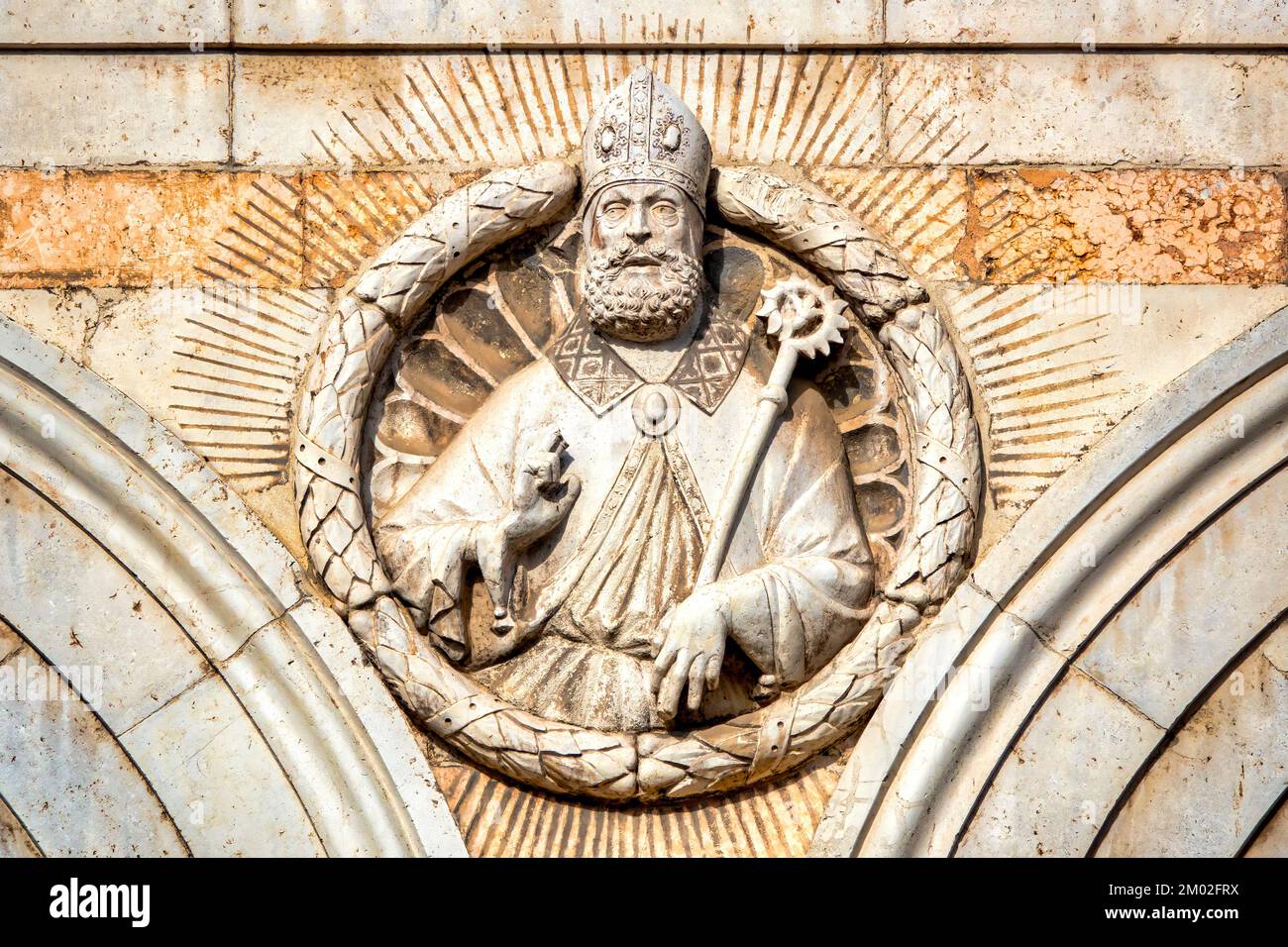 Bust of Saint Maurelius carved on the bell tower of the Cathedral, Ferrara, Italy Stock Photo