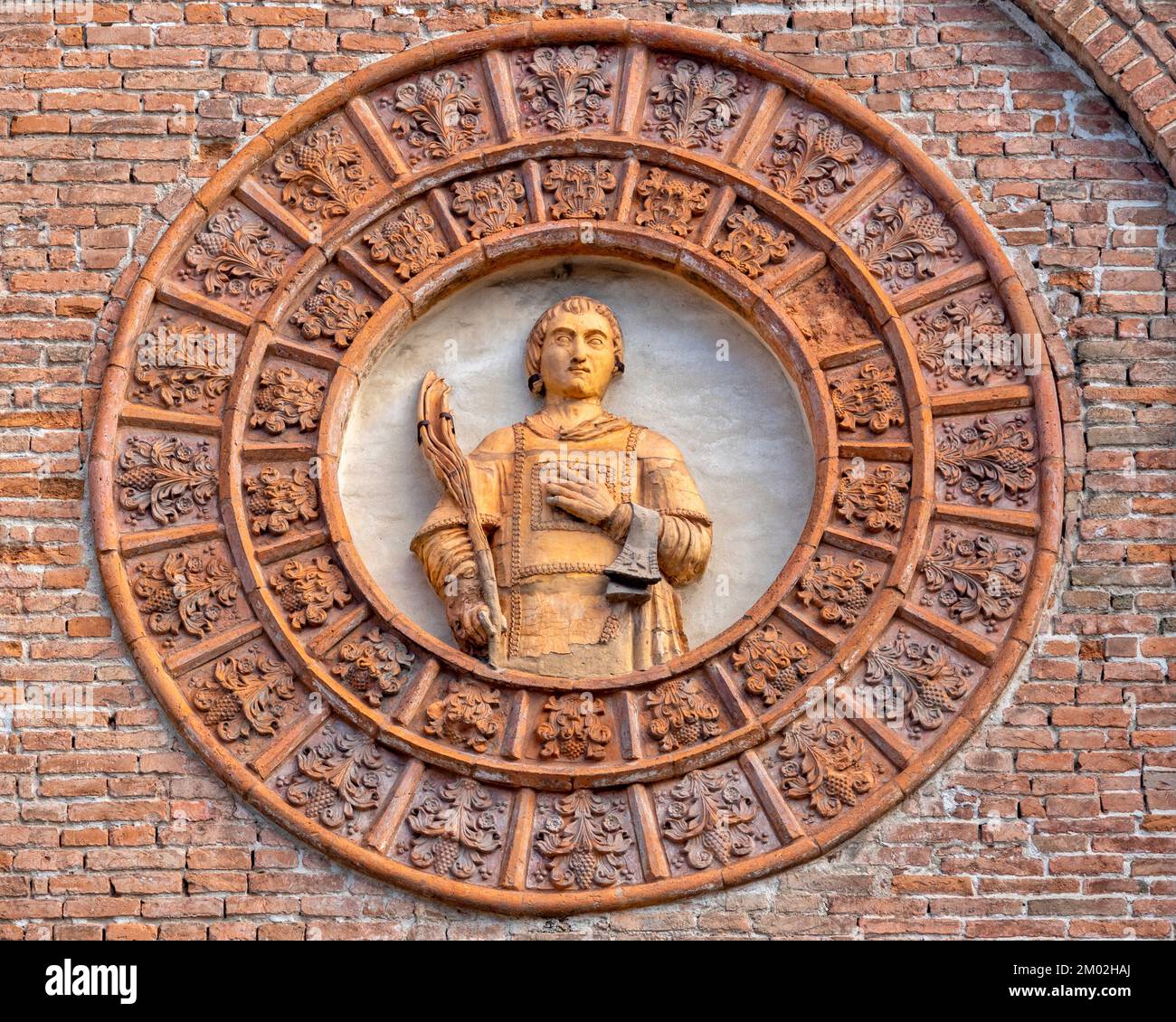 Terracotta bust of Santo Stefano on the facade of the Church of Santo Stefano, Ferrara Italy Stock Photo