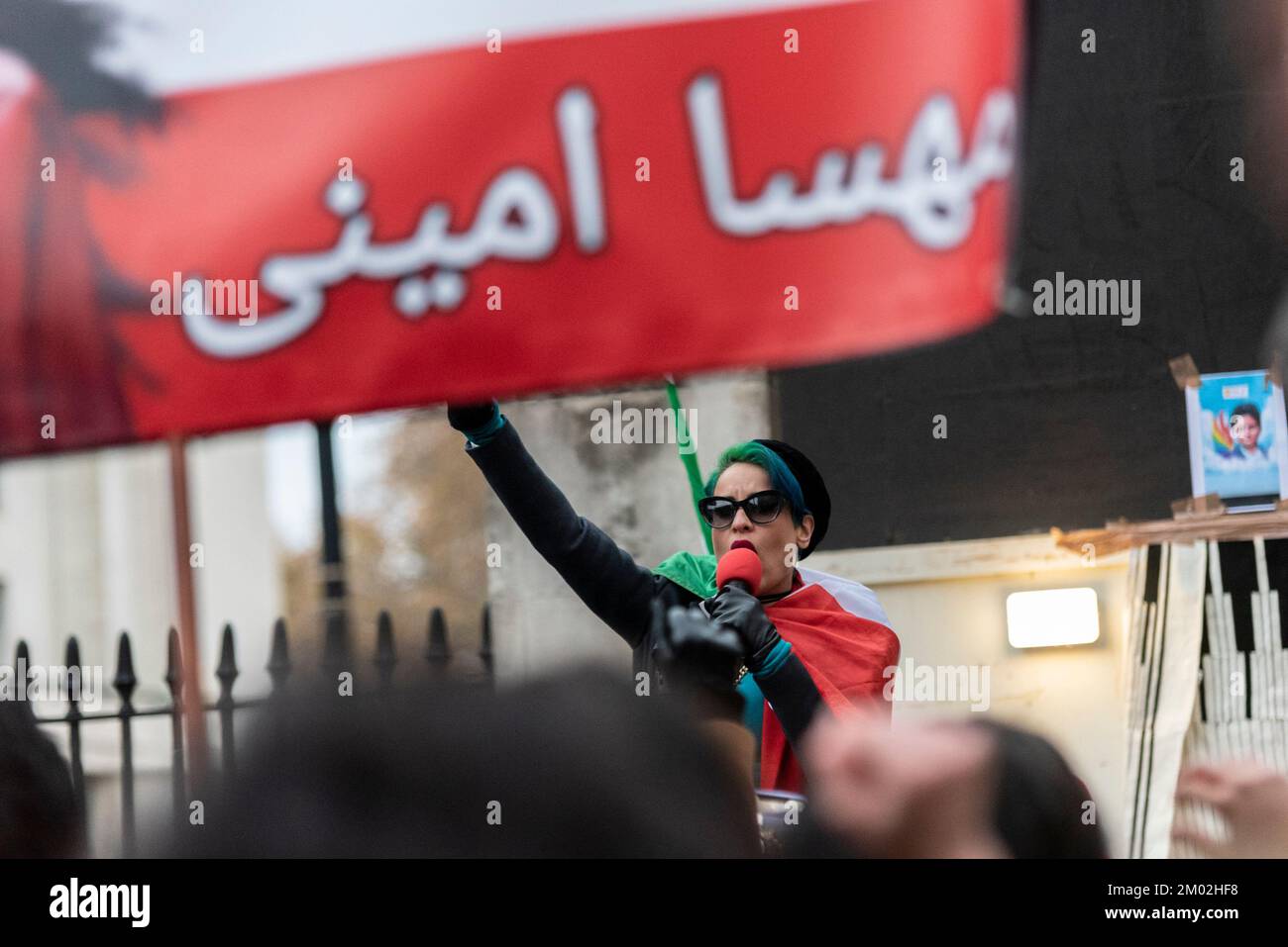 Westminster, London, UK. 3rd Dec, 2022. Protesters have gathered in Trafalgar Square and opposite Downing Street in Whitehall to protest against the actions of the Iranian regime. Branded Iranian Women Revolution, the aim is to replace Iran's extremist Islamic government with a democratic government. Female protester speaking Stock Photo