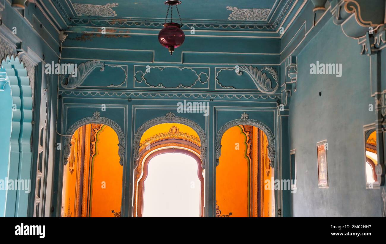 Beautiful light blue colored rooms inside Udaipur's city palace. Rajasthan, India. Colorful decorated Interior view of City Palace. Inside of palace l Stock Photo