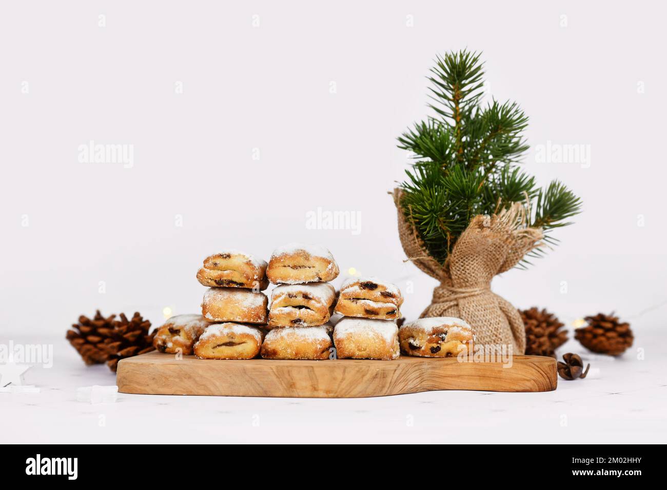 Small German Stollen cake pieces, a fruit bread with nuts, spices, and dried fruits with powdered sugar traditionally served during Christmas time Stock Photo