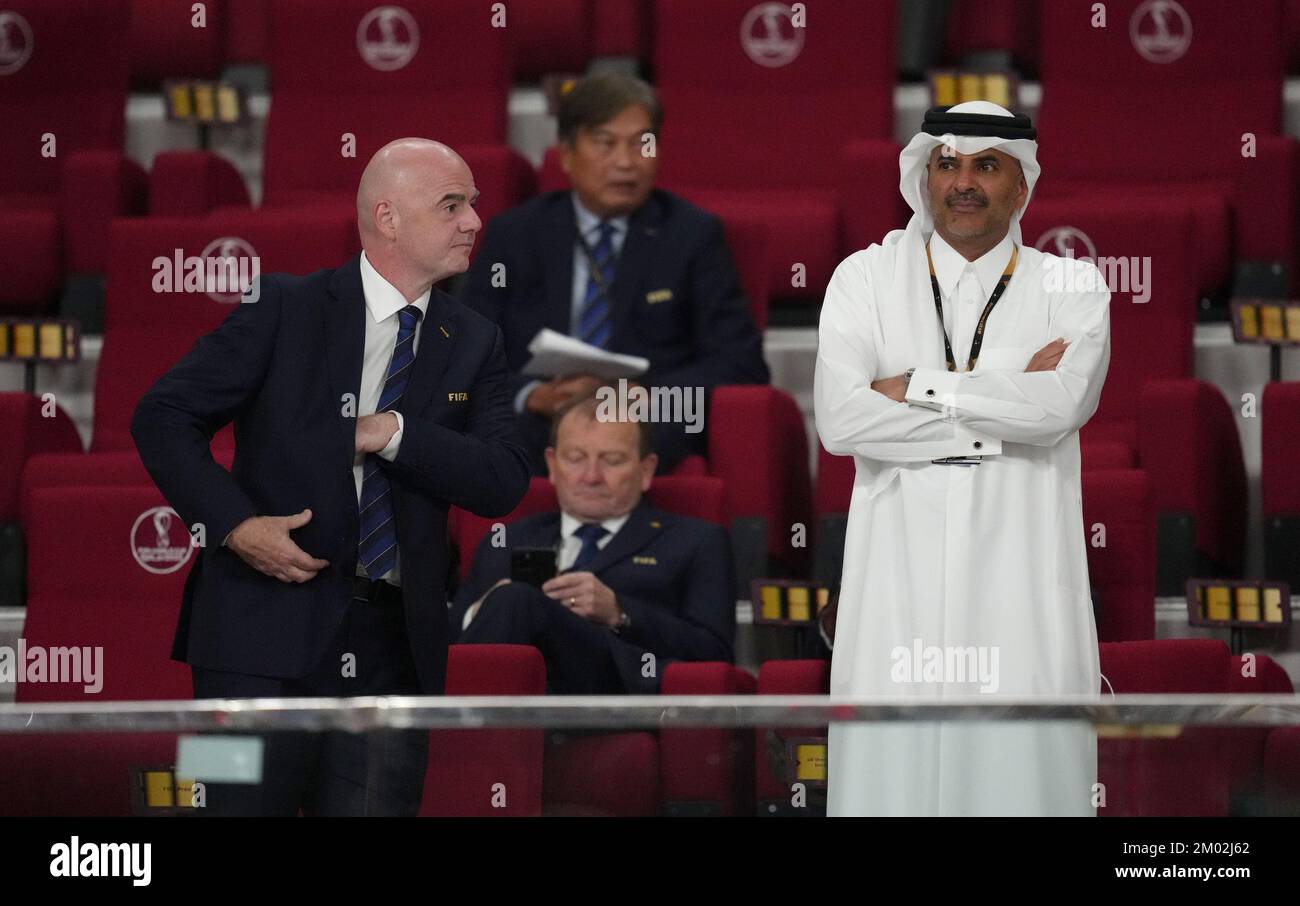 FIFA President Gianni Infantino (left) and Sheikh Khalid bin Khalifa bin Abdul Aziz Al Thani in the stands before the FIFA World Cup round of 16 match at the Khalifa International Stadium in Al Rayyan, Qatar. Picture date: Saturday December 3, 2022. Stock Photo
