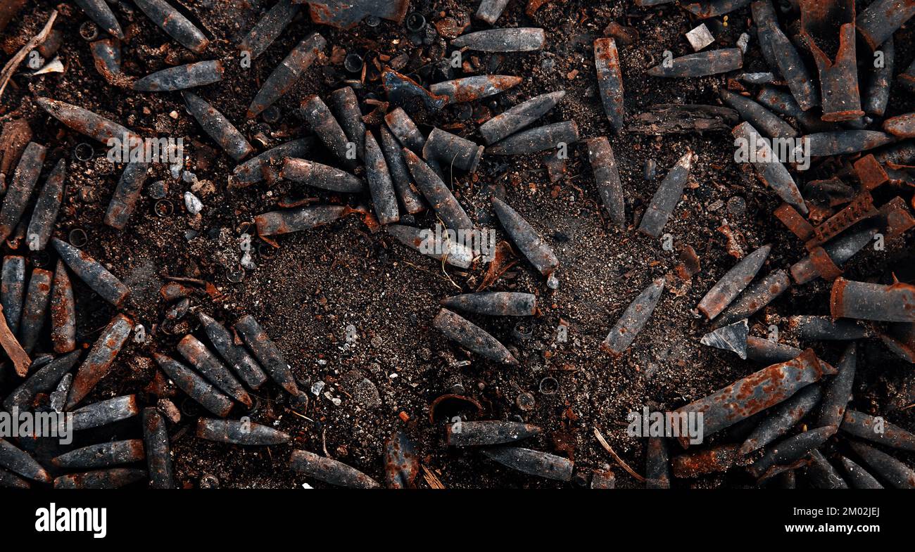 Burnt ammunition, bullets and casings after the fire. Burned arsenal of weapons, fire in the