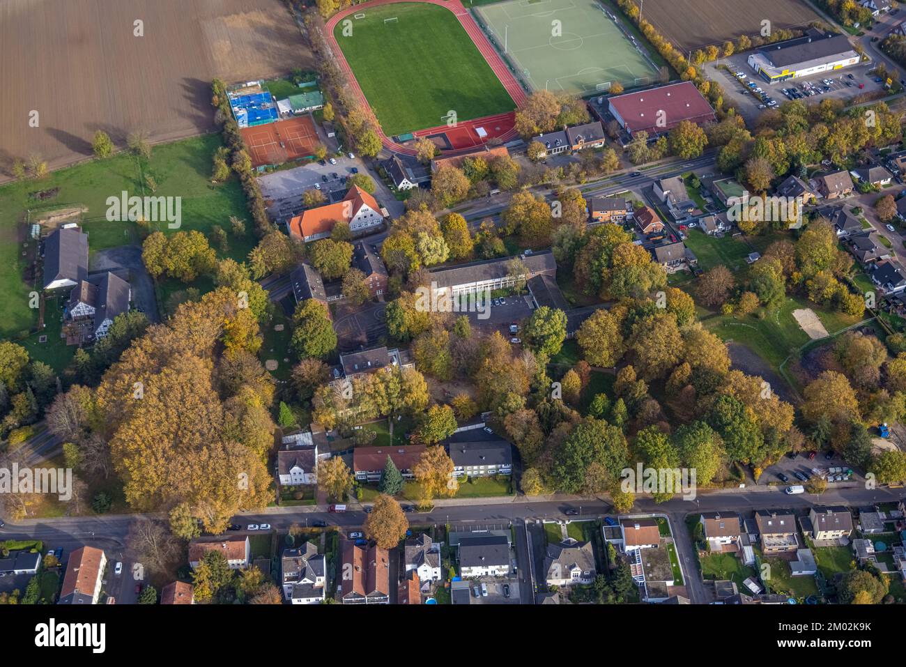 Aerial view, adult education center Kamen-Bönen, Villa Lach und Krach kindergarten, trees in autumn colors, Heeren-Werve, Kamen, Ruhr area, North Rhin Stock Photo