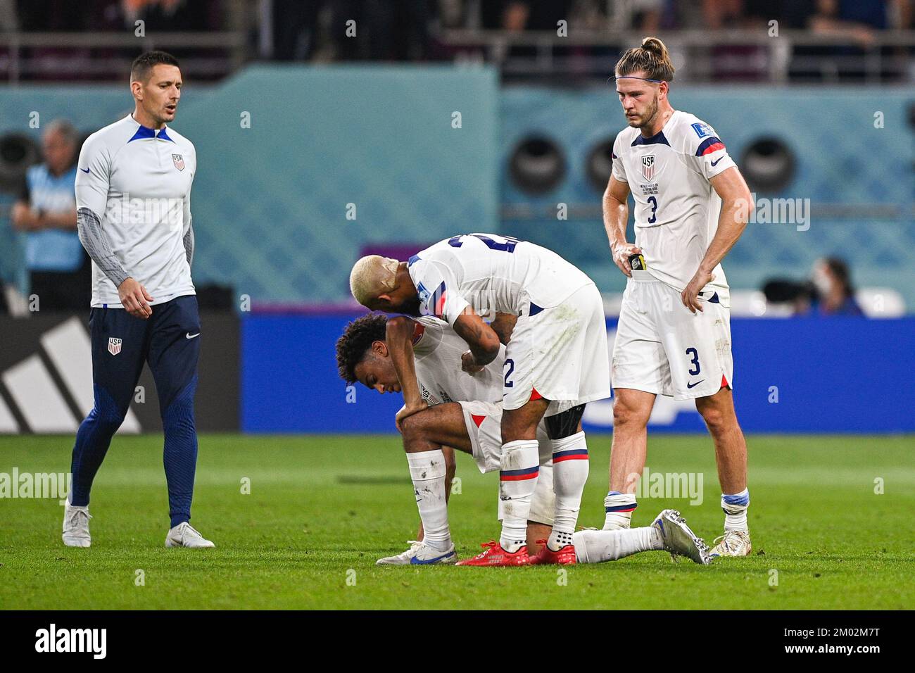 Doha, Qatar. 03rd Dec, 2022. DOHA, QATAR - DECEMBER 3: Tyler Adams of USA, DeAndre Yedlin of USA and Walker Zimmerman of USA looks dejected after the Round of 16 - FIFA World Cup Qatar 2022 match between Netherlands and USA at the Khalifa International Stadium on December 3, 2022 in Doha, Qatar (Photo by Pablo Morano/BSR Agency) Credit: BSR Agency/Alamy Live News Stock Photo