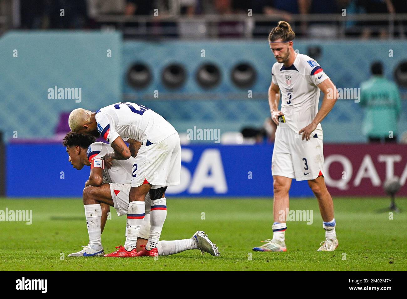 Doha, Qatar. 03rd Dec, 2022. DOHA, QATAR - DECEMBER 3: Tyler Adams of USA, DeAndre Yedlin of USA and Walker Zimmerman of USA looks dejected after the Round of 16 - FIFA World Cup Qatar 2022 match between Netherlands and USA at the Khalifa International Stadium on December 3, 2022 in Doha, Qatar (Photo by Pablo Morano/BSR Agency) Credit: BSR Agency/Alamy Live News Stock Photo