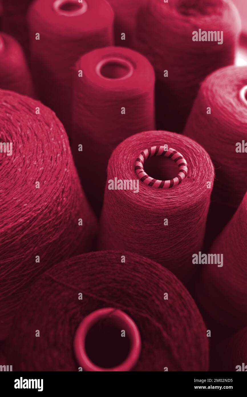 Trending color 2023. Composition of colorful vibrant wool threads from above. Stock Photo