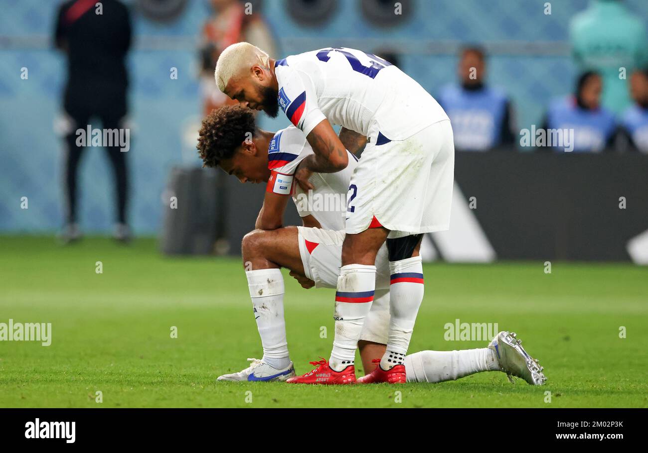 Doha, Qatar. 03rd Dec, 2022. DOHA, QATAR - DECEMBER 03: FIFA World Cup Qatar 2022 Round of 16 match between Netherlands and USA at Khalifa International Stadium on December 03, 2022 in Doha, Qatar. Niederlande USA Tyler Adams of USA DeAndre Yedlin of USA look dejected after their sides' elimination from the tournament Fussball WM 2022 in Qatar FIFA Football World Cup 2022 Credit: diebilderwelt/Alamy Live News Stock Photo