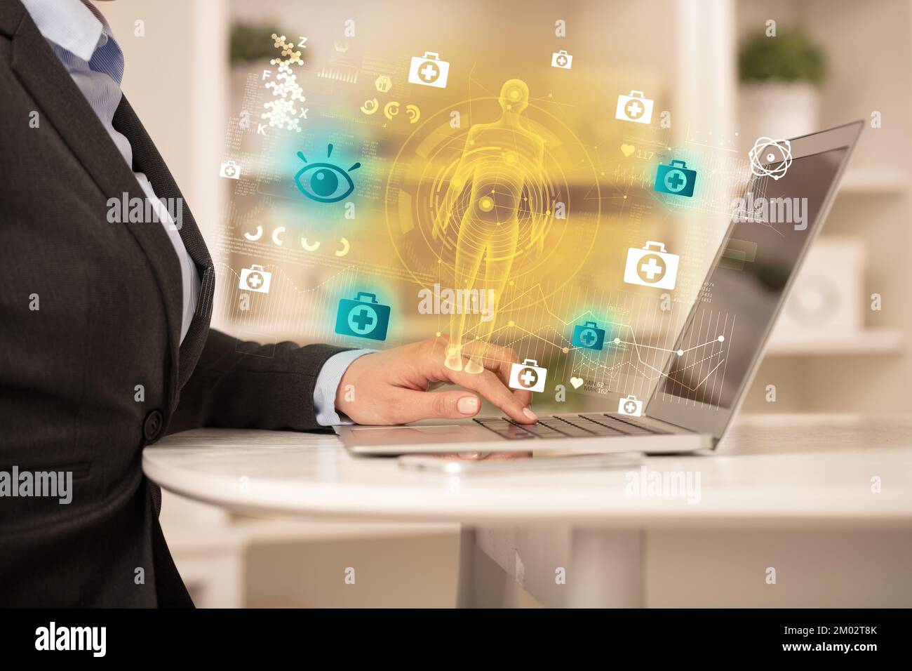 Doctor working on laptop with healthcare concept Stock Photo