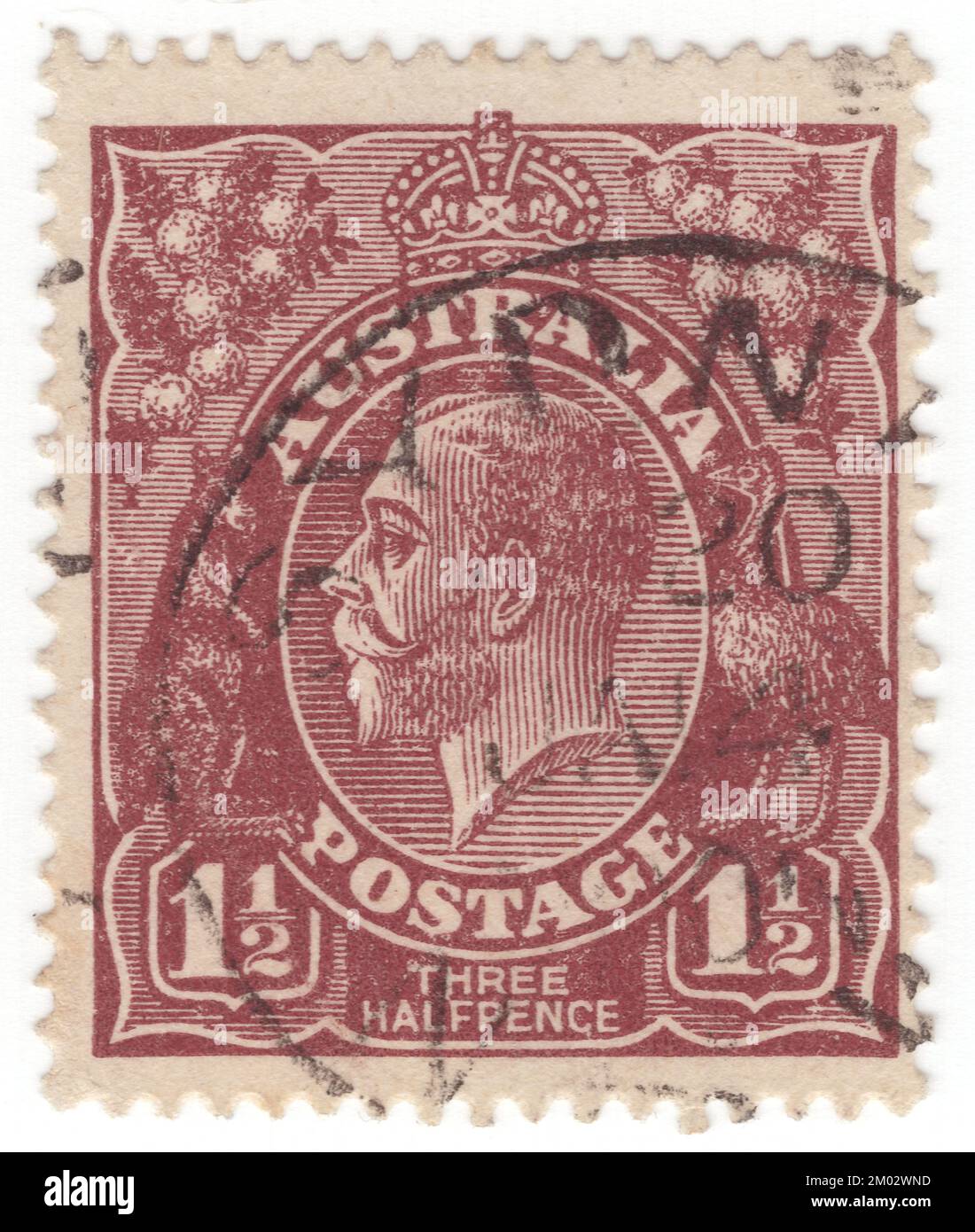 AUSTRALIA — 1924: An 1½ pence red-brown postage stamp showing portrait of King George V (George Frederick Ernest Albert) was King of the United Kingdom and the British Dominions, and Emperor of India, from 6 May 1910 until his death in 1936. Born during the reign of his grandmother Queen Victoria, George was the second son of Albert Edward, Prince of Wales, and was third in the line of succession to the British throne behind his father and his elder brother, Prince Albert Victor Stock Photo