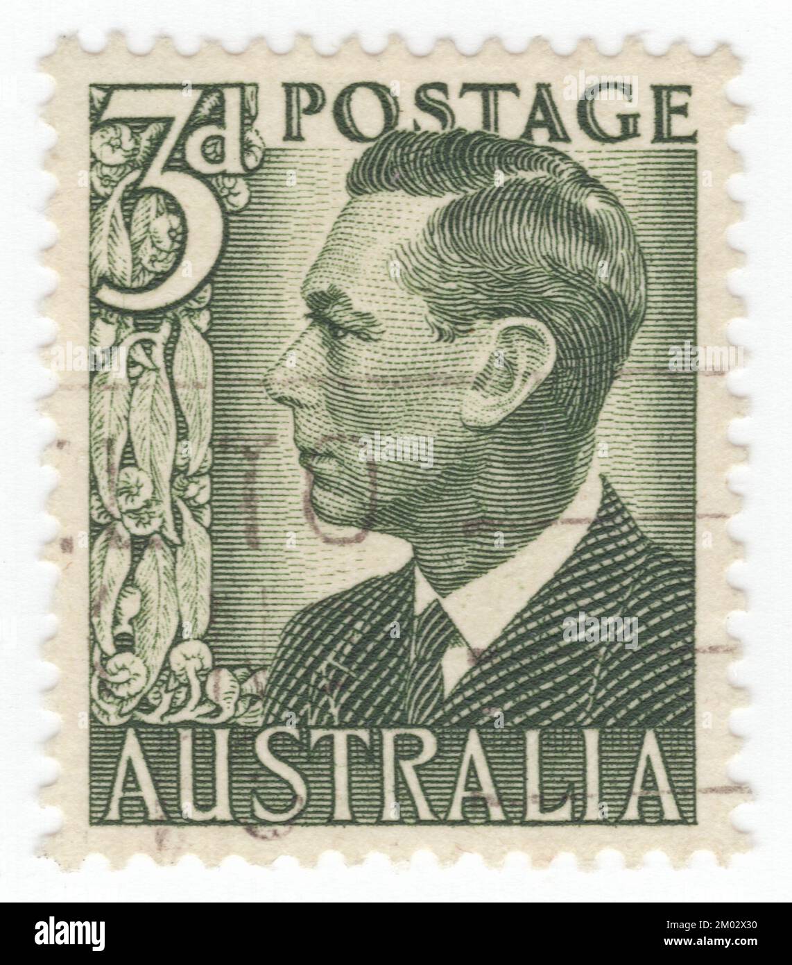AUSTRALIA — 1951: An 3 pences dull green postage stamp showing portrait of King George VI (Albert Frederick Arthur George; 14 December 1895 – 6 February 1952). He was King of the United Kingdom and the Dominions of the British Commonwealth from 11 December 1936 until his death in 1952. He was concurrently the last Emperor of India until August 1947, when the British Raj was dissolved. The future George VI was born in the reign of his great-grandmother Queen Victoria; he was named Albert at birth after his great-grandfather Albert, Prince Consort, and was known as 'Bertie' Stock Photo