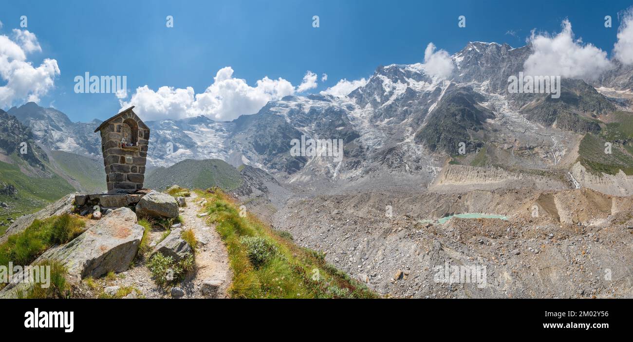 The panorama of Monte Rosa and Punta Gnifetti paks with glacier Belvedere and the little chapell - Valle Anzasca valley. Stock Photo