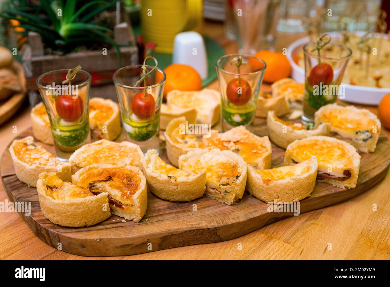 Catering appetizers on the table. Shot glasses with caprese canapés and