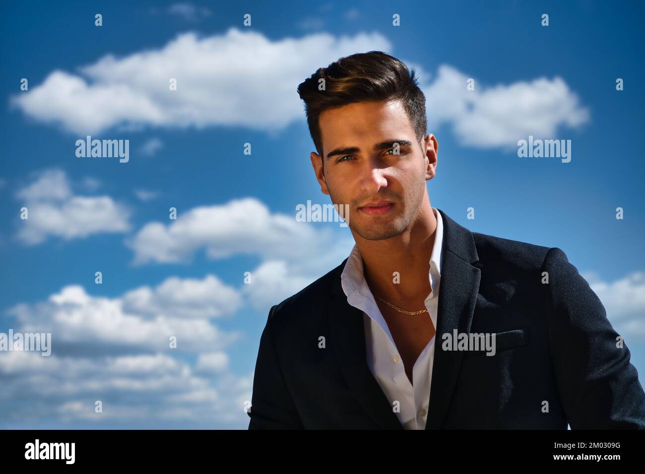 Handsome man in white shirt and jacket outdoor Stock Photo