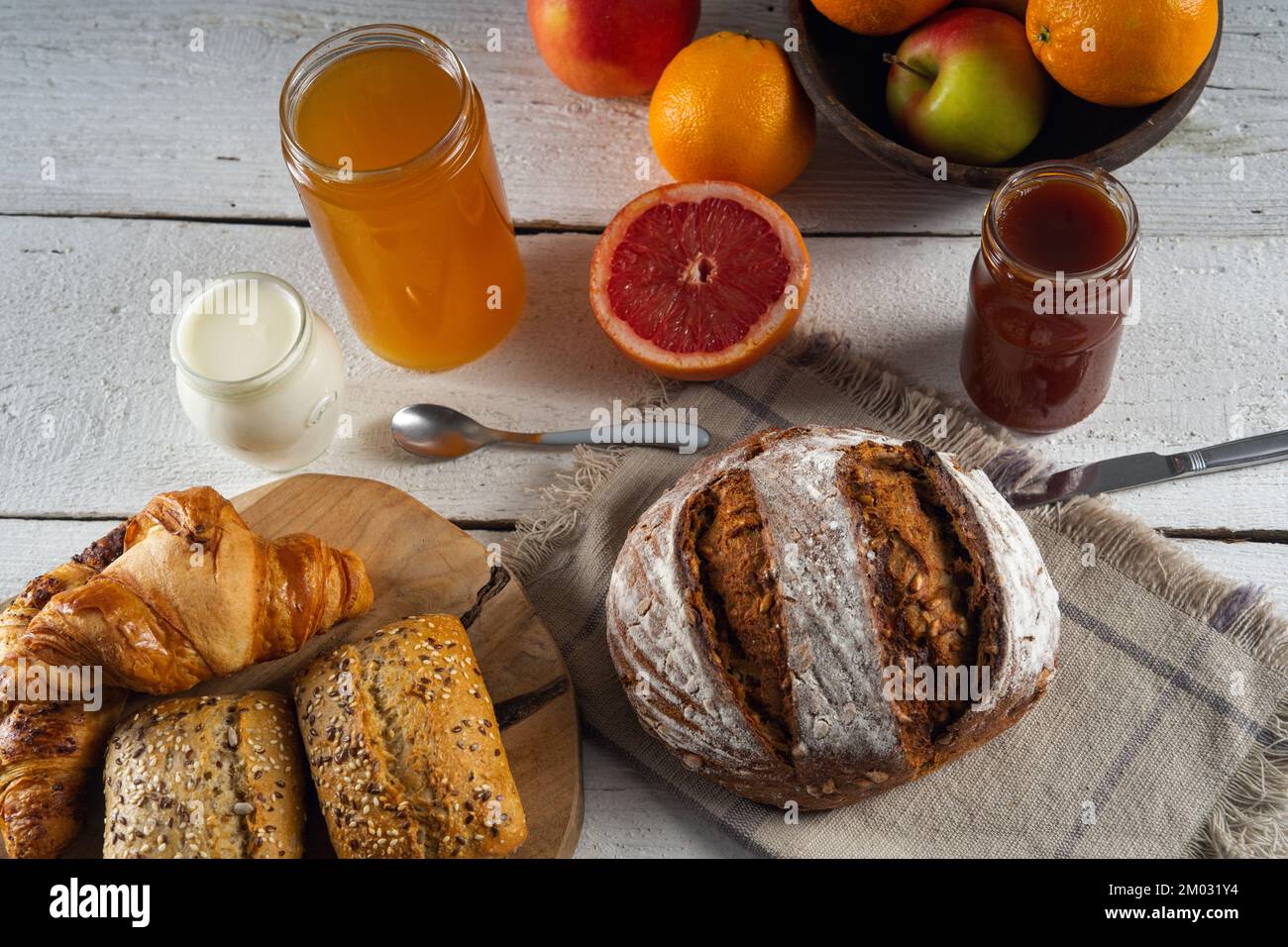 Scandinavian bread, rolls with sesame seeds on rustical wooden table ...