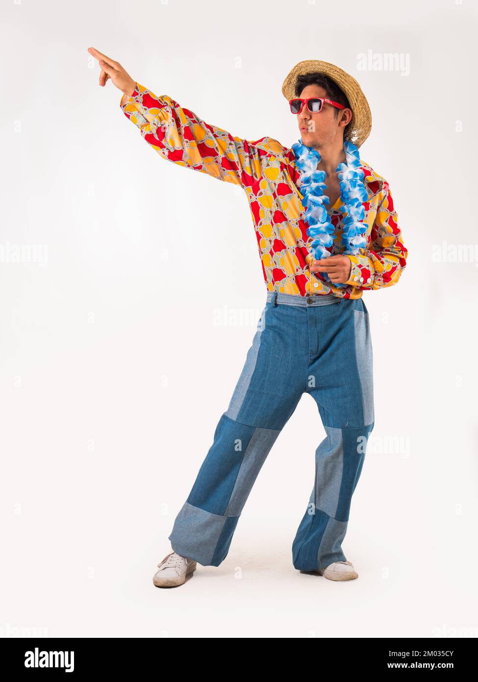 Young man in stylish colorful 60's outfit on white Stock Photo