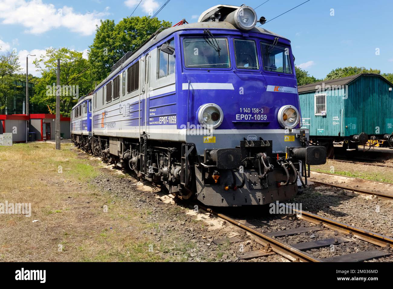 Kolobrzeg, Poland - June 23, 2016: EP07 electric locomotive is painted in white blue colors of PKP Intercity it is parked at the side track of the tra Stock Photo