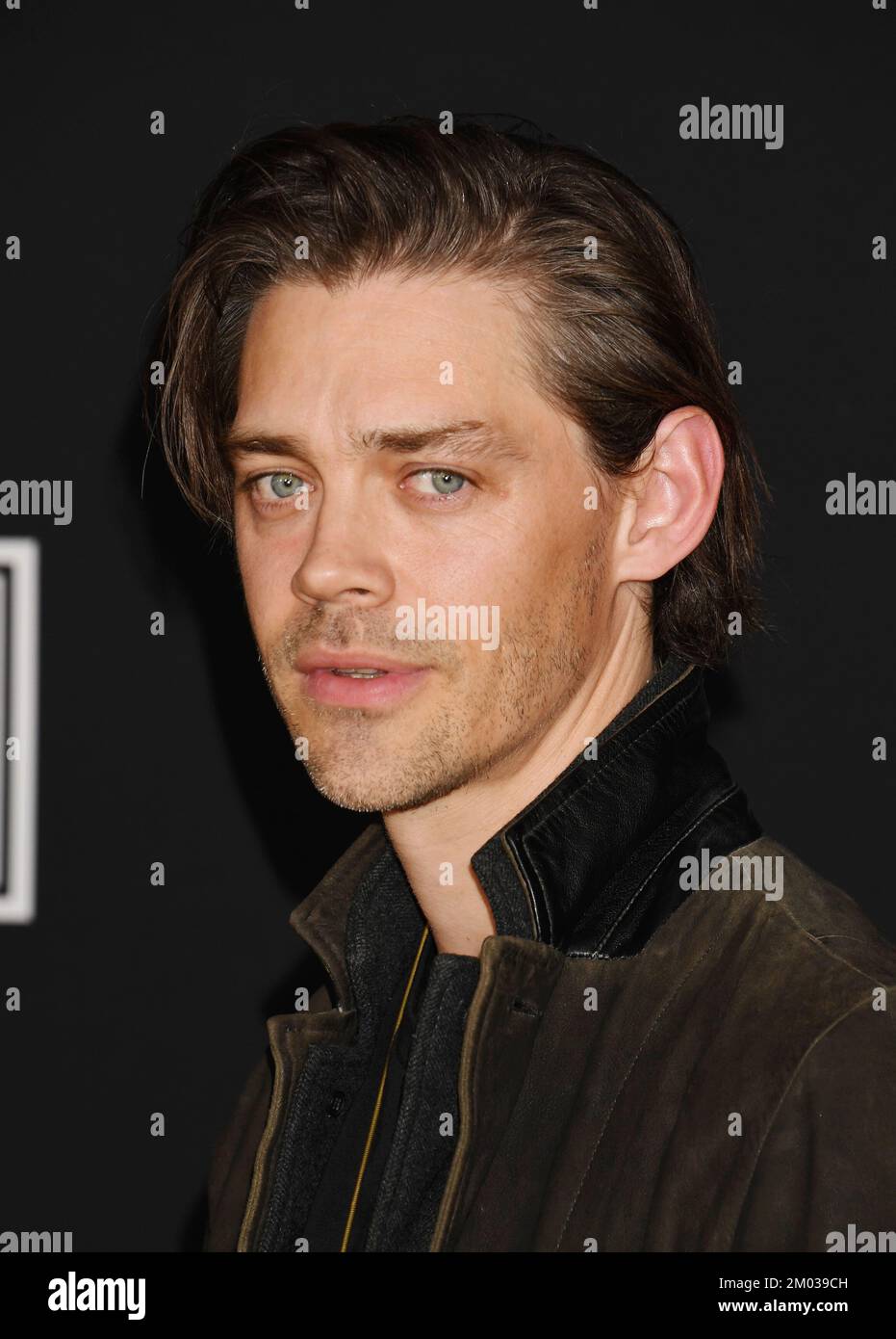 LOS ANGELES, CALIFORNIA DECEMBER 02 Tom Payne attends the Los