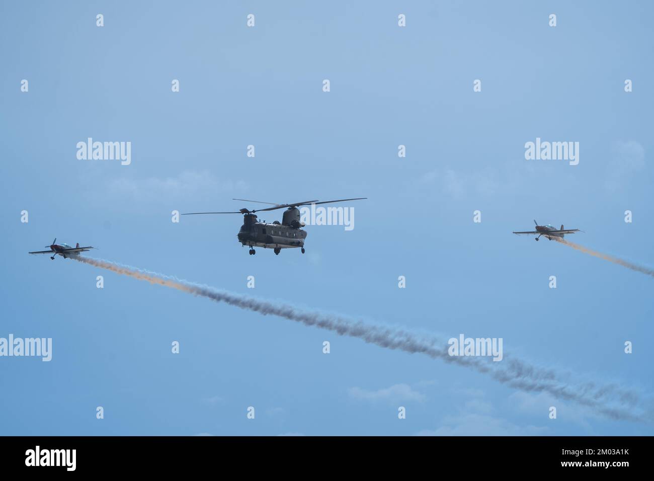 Chinook Helicopter And Extra 300 Aircraft Flyby Bournemouth Air Festival 2022 Stock Photo