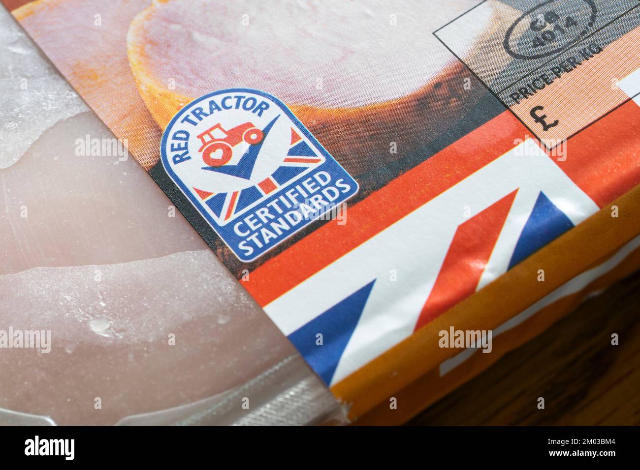 Closeup on Red Tractor logo. Assured Food Standards is a UK company