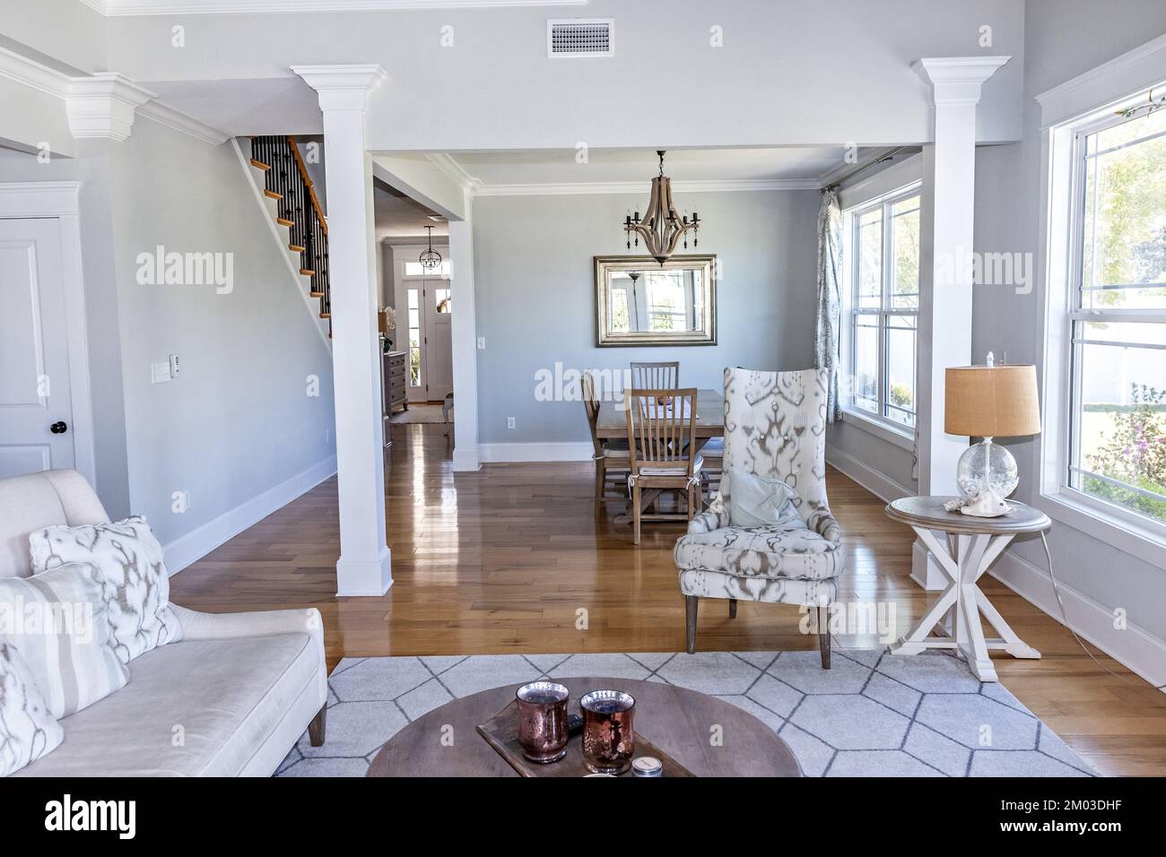 A light and bright open concept living room den with vaulted ceilings in a new construction
