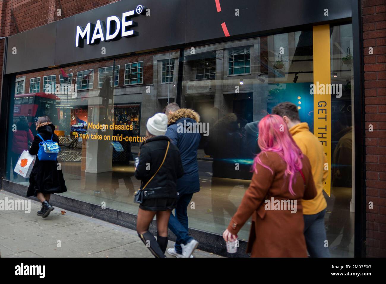 Made.com furniture store in Soho, London, UK. On 9 November 2022, Made.com went into administration. People passing showroom window Stock Photo