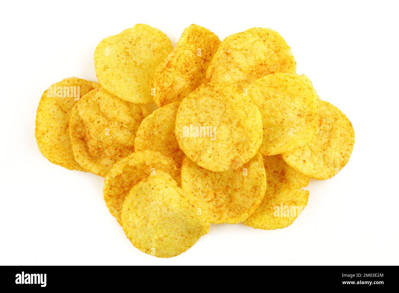 Pile of red paprika seasoned potato chips isolated on white background