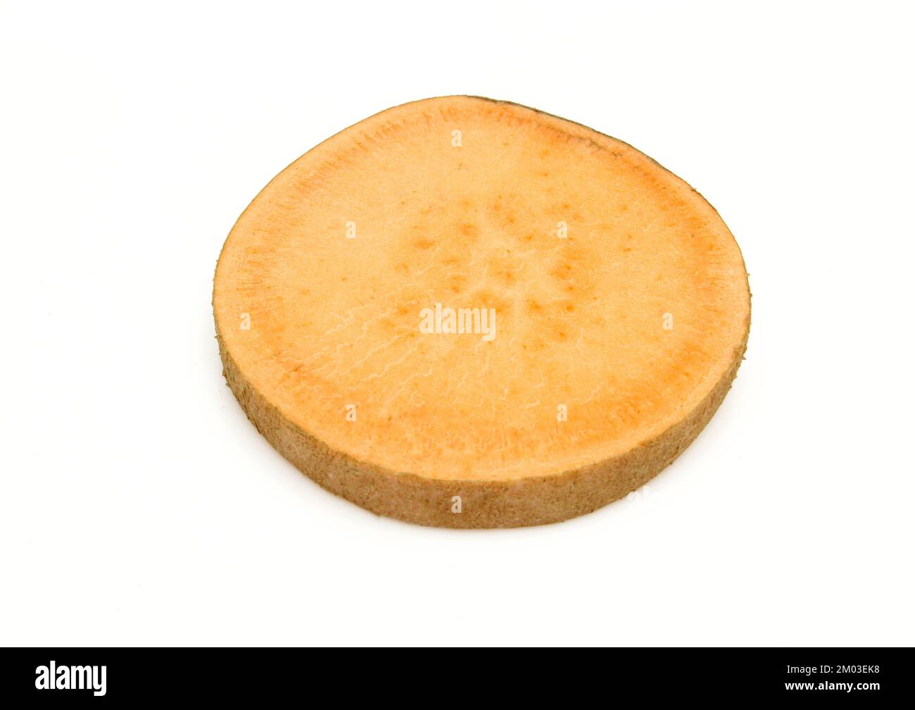 Sliced piece of sweet potato isolated on white background. Uncooked piece of batata Stock Photo