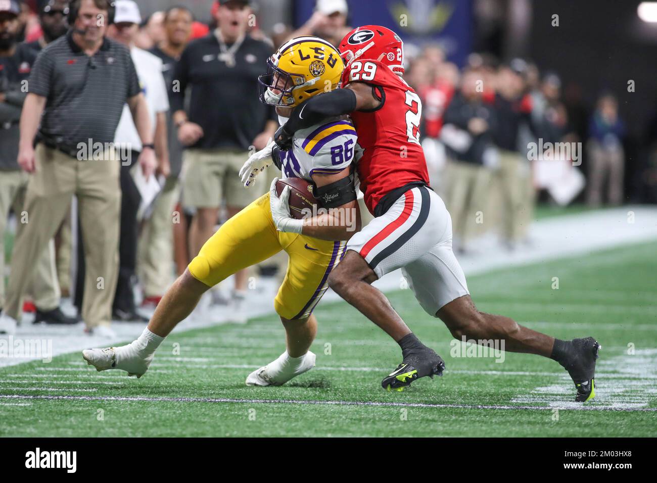 Atlanta, GA, USA. 03rd Dec, 2022. Georgia's Chris Smith (29) brings ...