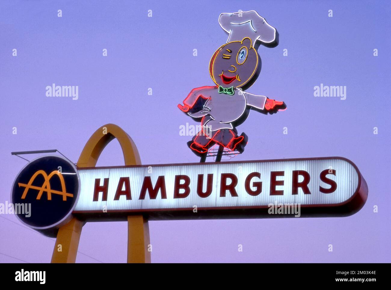 Vintage neon sign for the McDonalds in Downey, CA. featuring the original mascot Speedee. Stock Photo