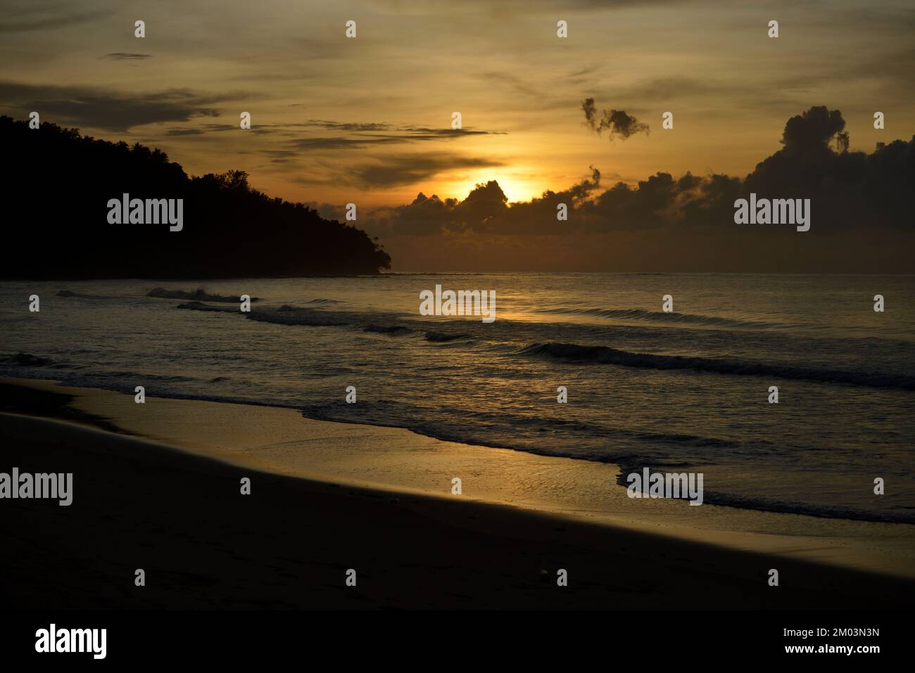 Sunset over the beach at the Tip of Borneo, Sabah, Malaysia. Stock Photo