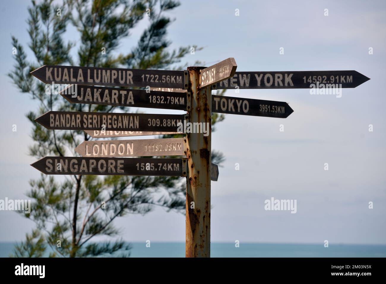 A distance marker at the Tip of Borneo, Sabah, Malaysia. Stock Photo