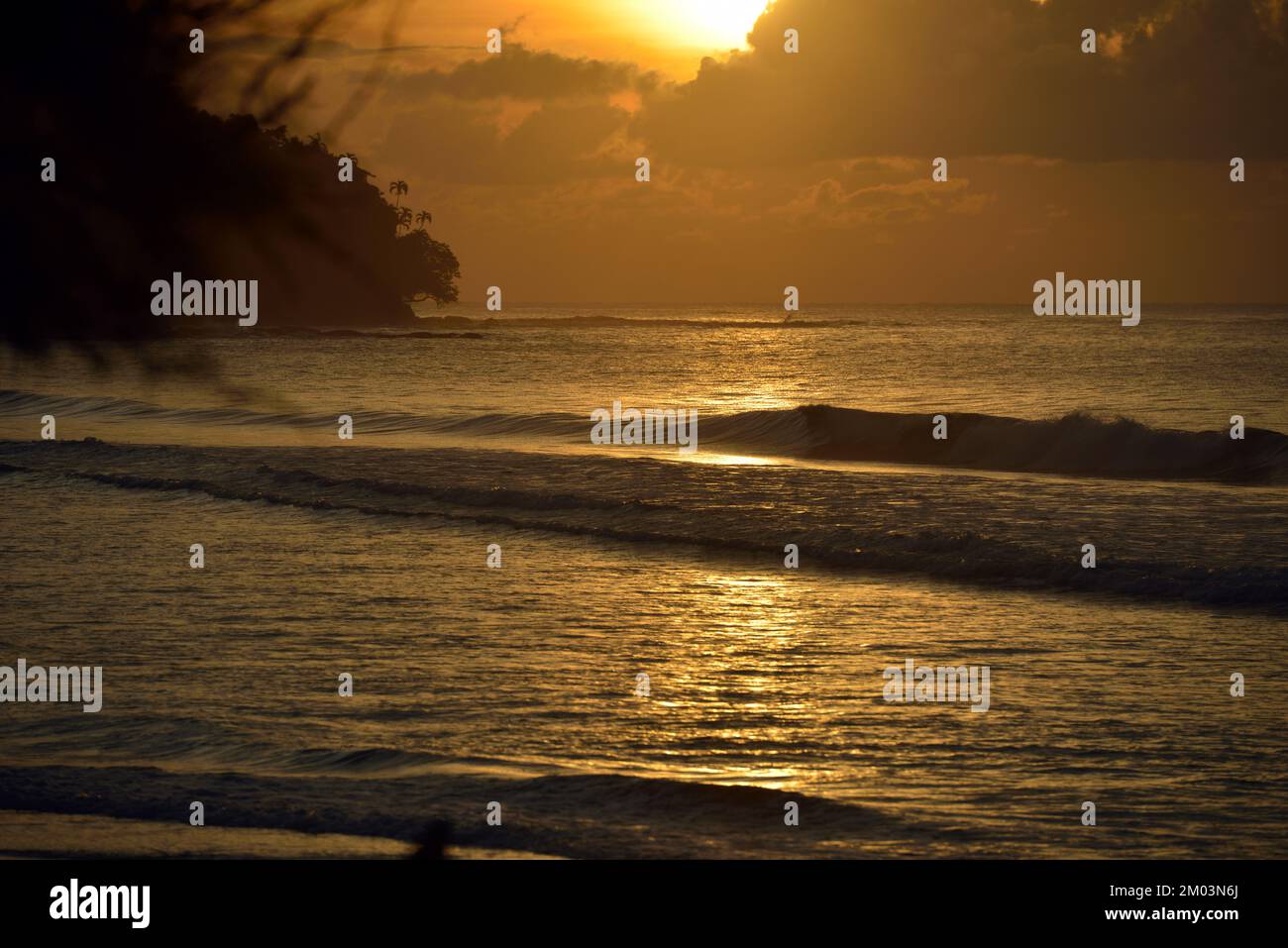 Sunset over the beach at the Tip of Borneo, Sabah, Malaysia. Stock Photo