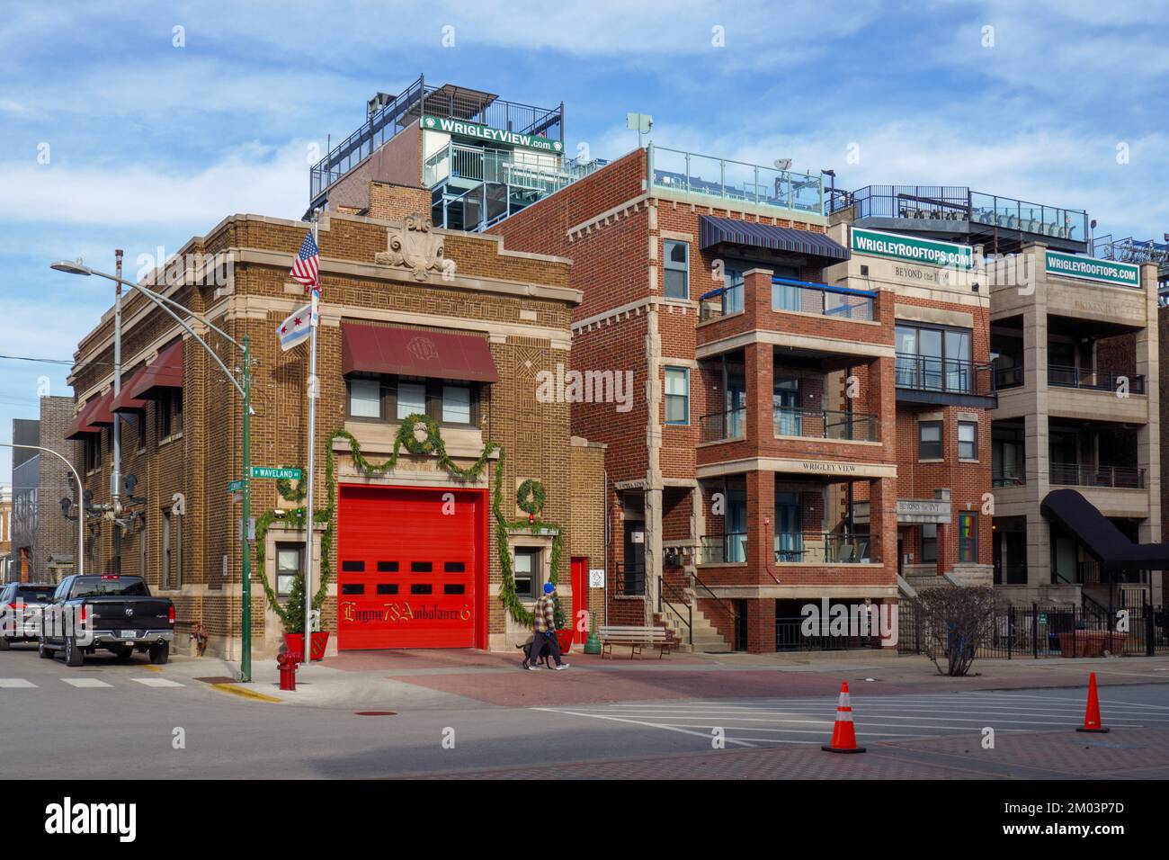 Fire station and apartment buildings with rooftop bleachers across