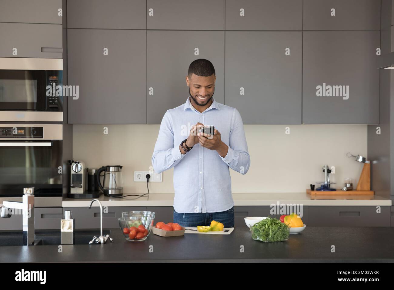 Young african black man eating hi-res stock photography and images - Alamy