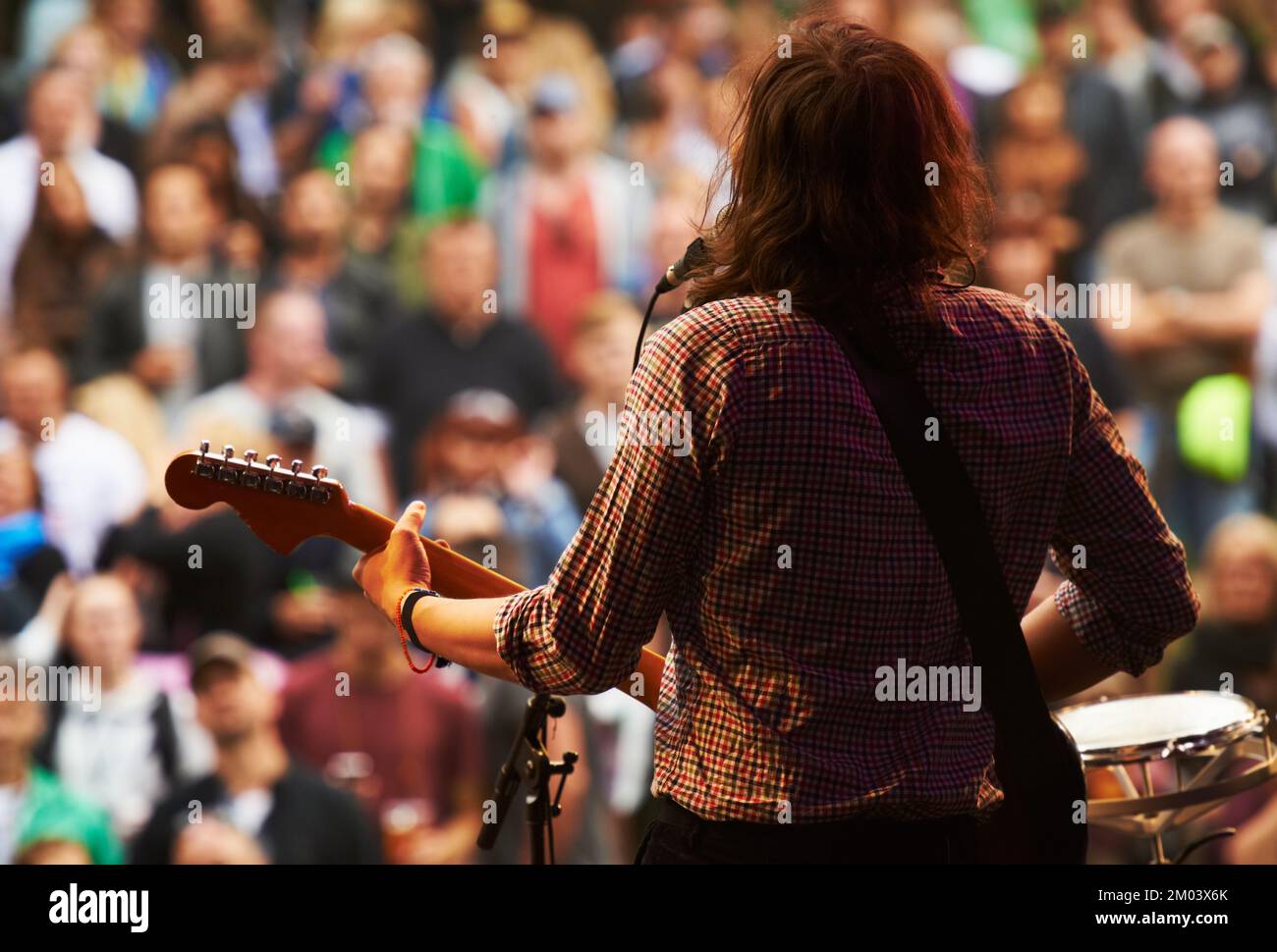 Ready to rock. a musicians feet on stage at an outdoor music festival. Stock Photo