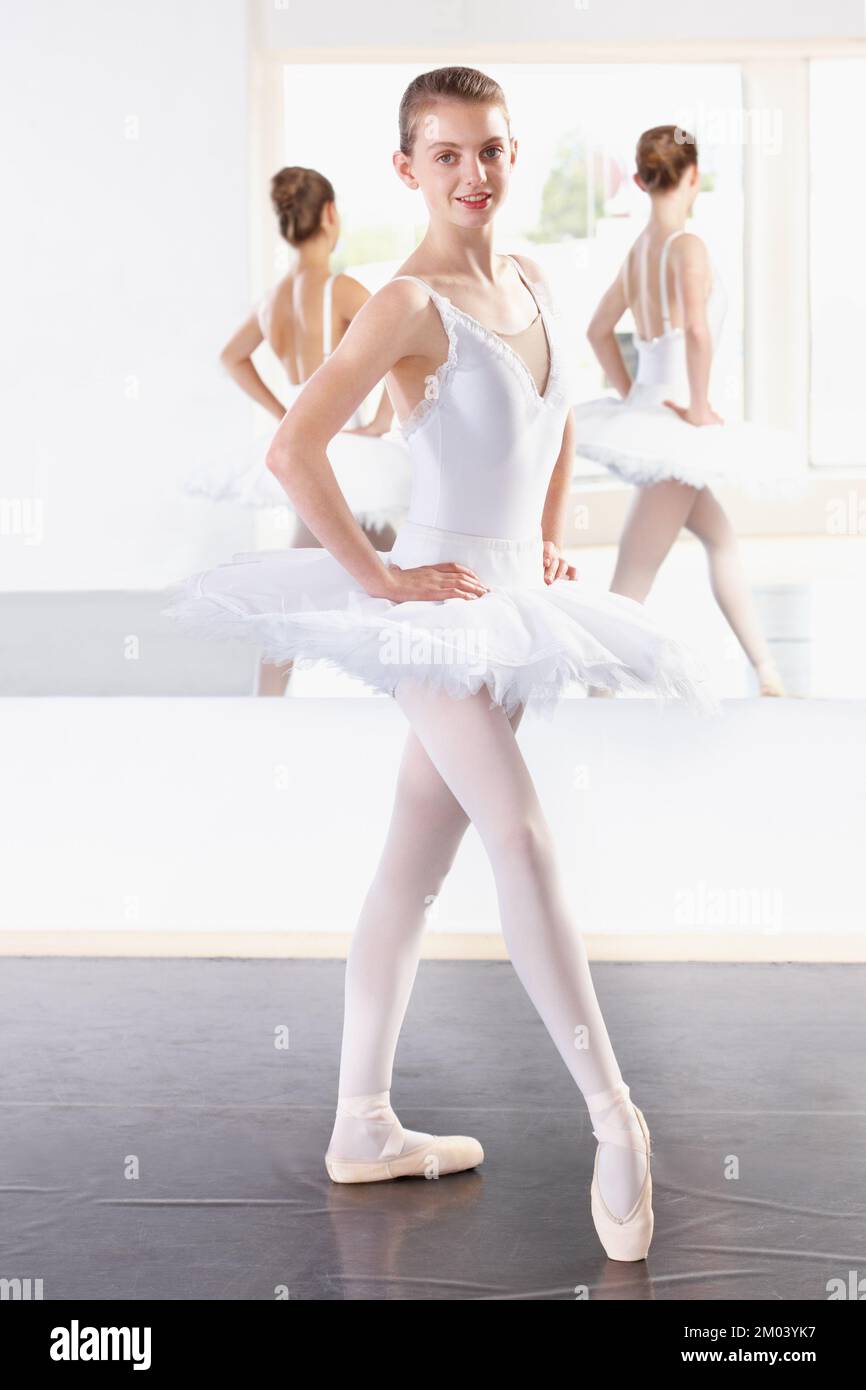 Ballet begins here. Full length portrait of a young ballerina practicing in a dance studio. Stock Photo