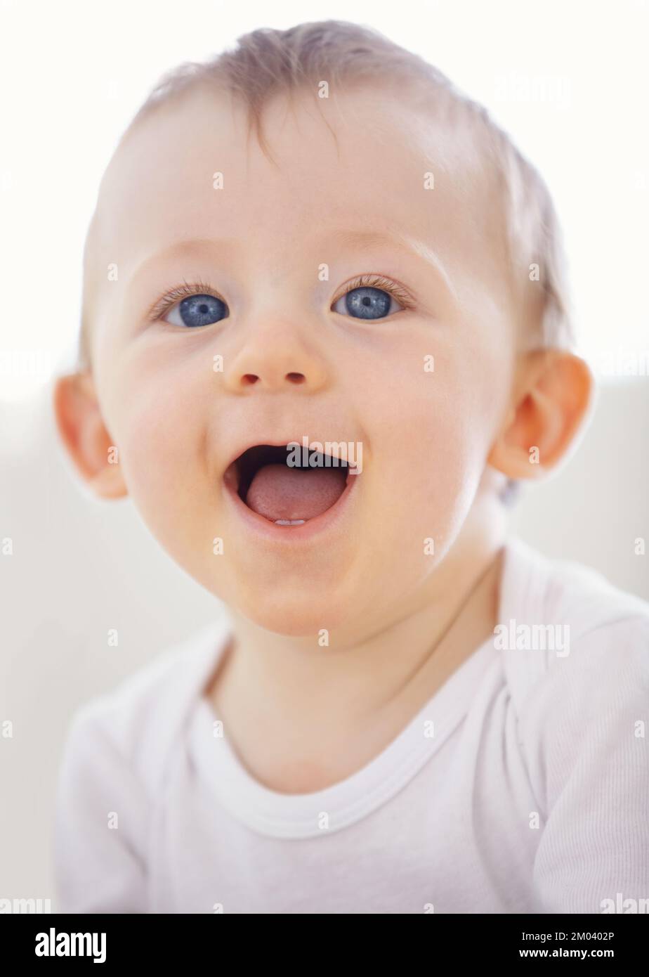 Hes a bundle of laughs. Portrait of an adorable baby boy laughing. Stock Photo