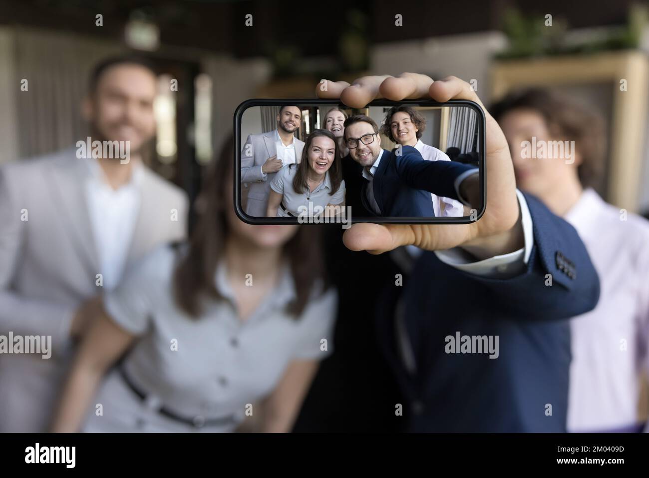 Close up on cellphone screen view of happy business people Stock Photo ...