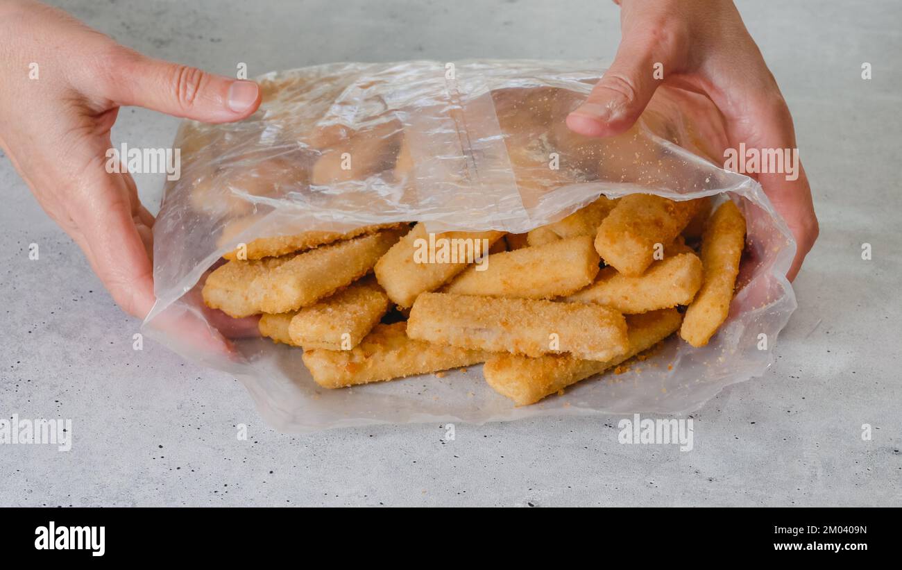 Breaded fish sticks frozen. Plastic bag of fish sticks in a crunchy